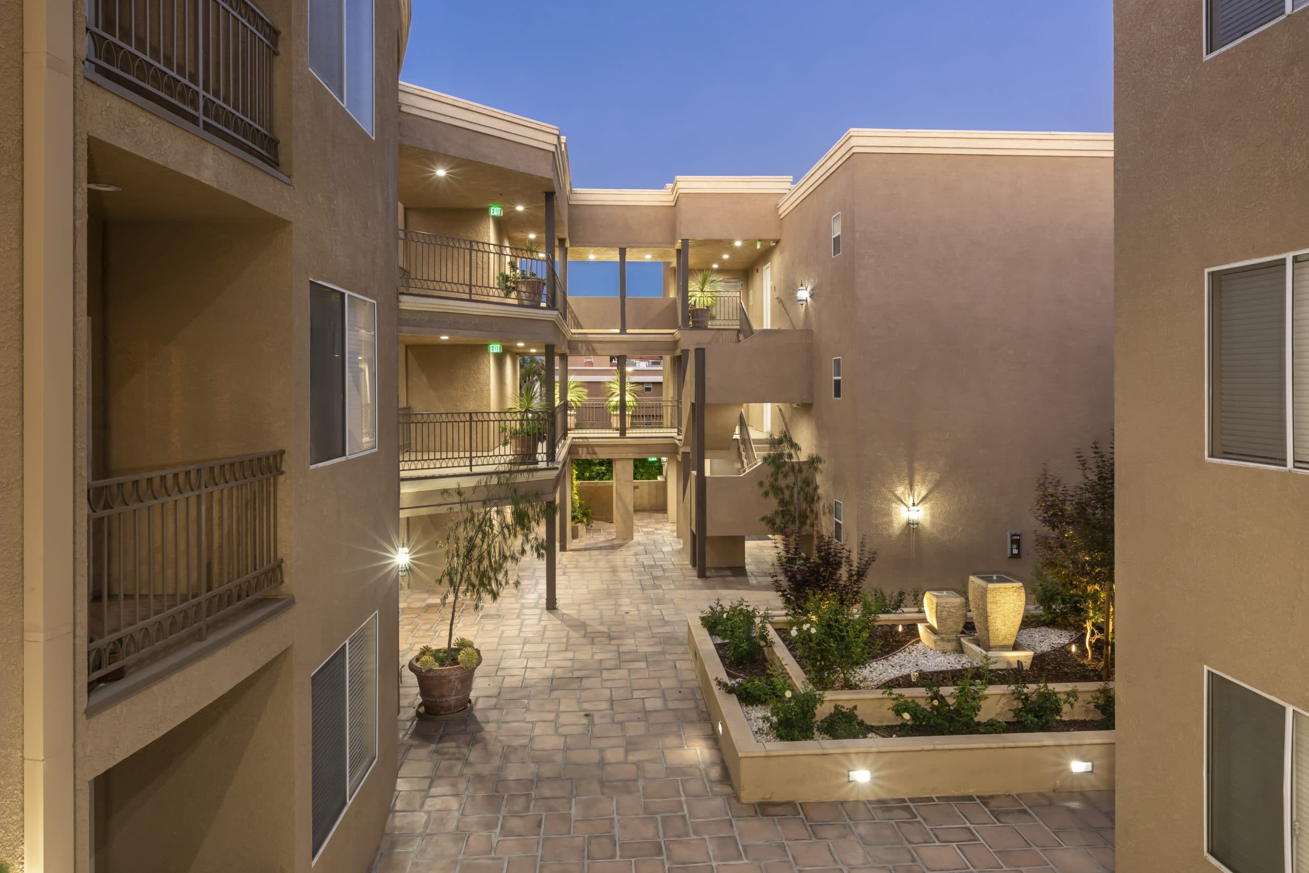 Apartments In Sherman Oaks CA Night Time Balcony View Of Courtyard And Surrounding Apartment Builings Scaled 