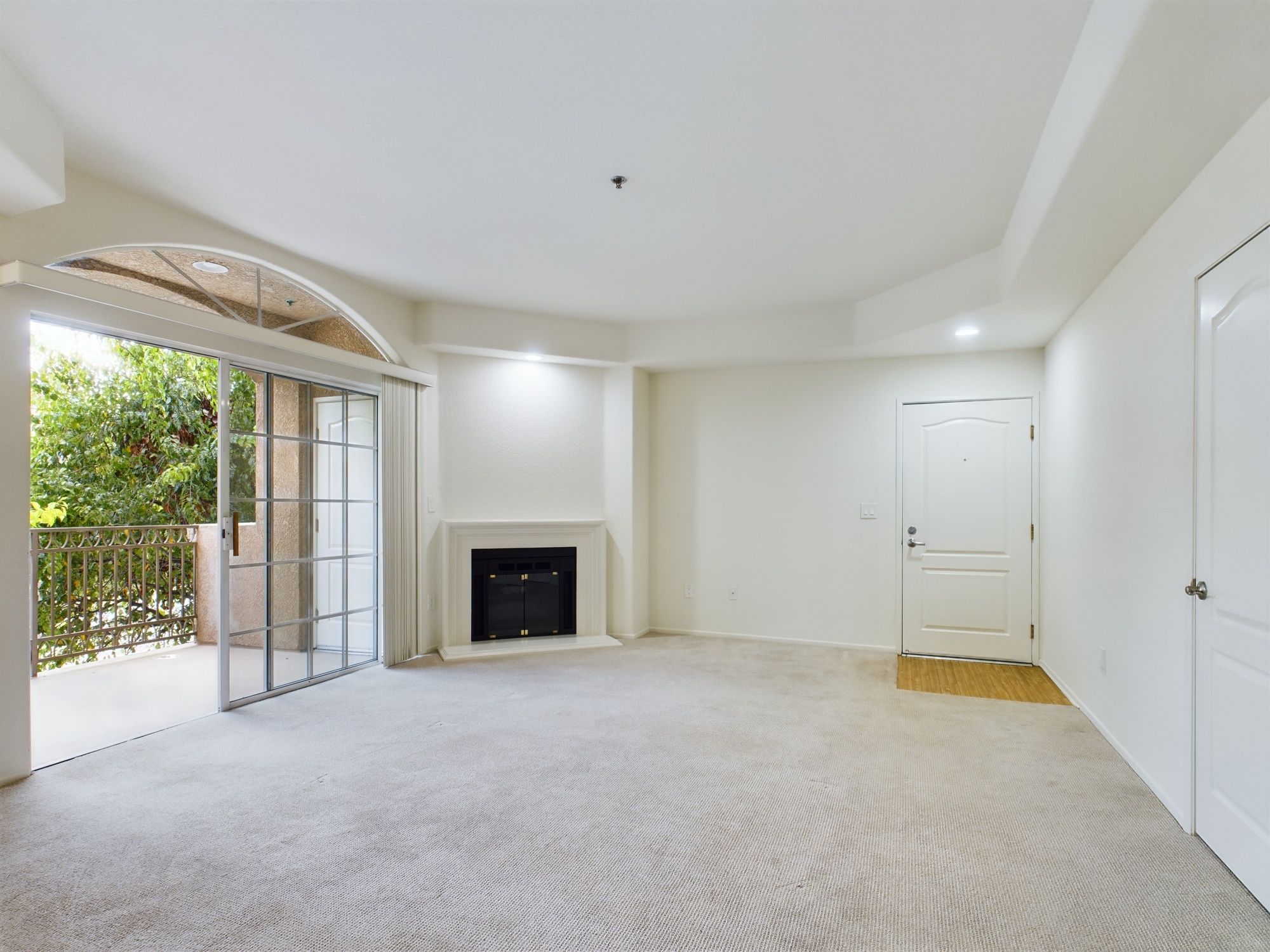 Apartments in Sherman Oaks Empty apartment living room with carpet flooring, a fireplace, sliding glass door, and balcony access. Mark Twain Apartments in Sherman Oaks 4251 Fulton Ave Sherman Oaks, CA 91423 P: 844-674-0992 TTY: 711 F: 818-484-4007